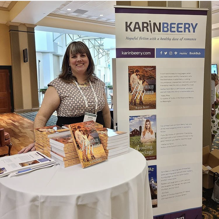 Interviewee Karin Beery by her book table.