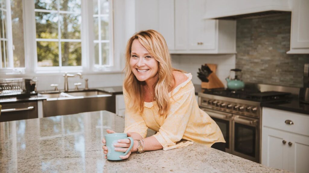 Sandy Cooper smiling in her kitchen after she quit social media.